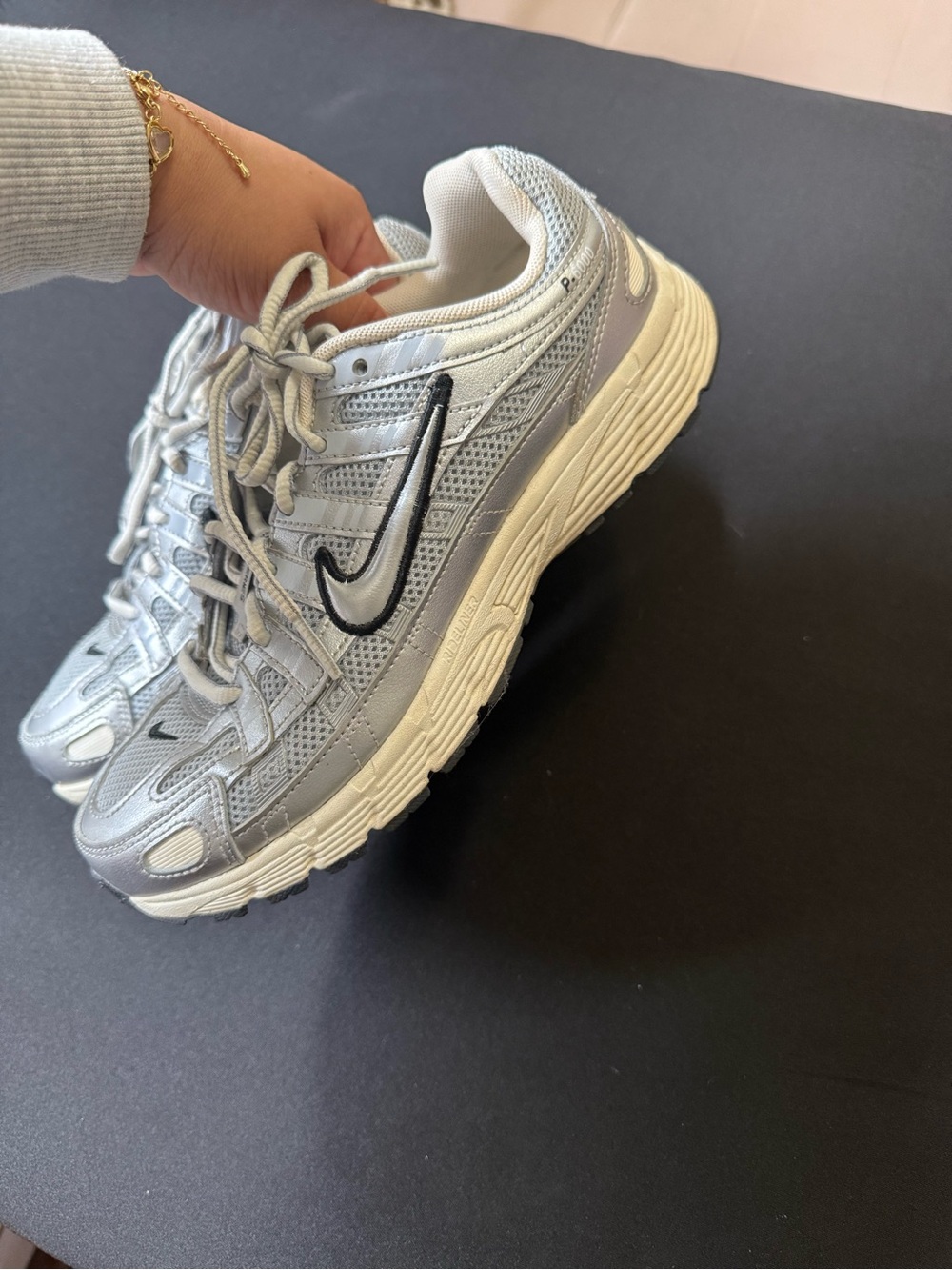 Nike Women's Silver & White Sneakers with Black Swoosh